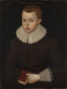 Front view, three-quarter length portrait of boy looking straight at us